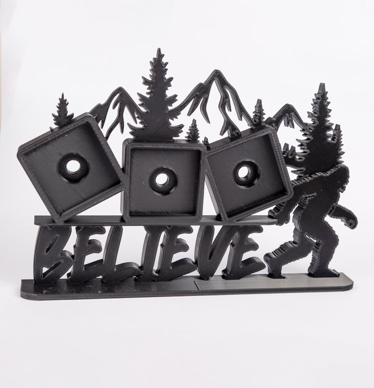Bigfoot Believe photomagnet frame with mountain backdrop and three 2-inch square slots for photomagnets
