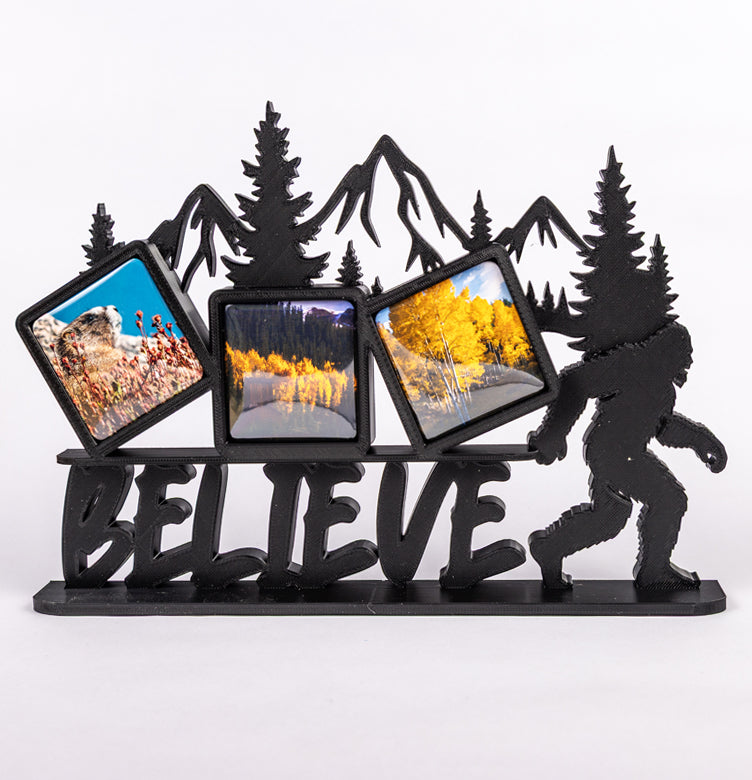Bigfoot Believe photomagnet frame with mountain backdrop and three 2-inch square slots for photomagnets
