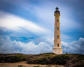 California Lighthouse tower against dramatic Caribbean sky in Aruba - 16x20 metal print