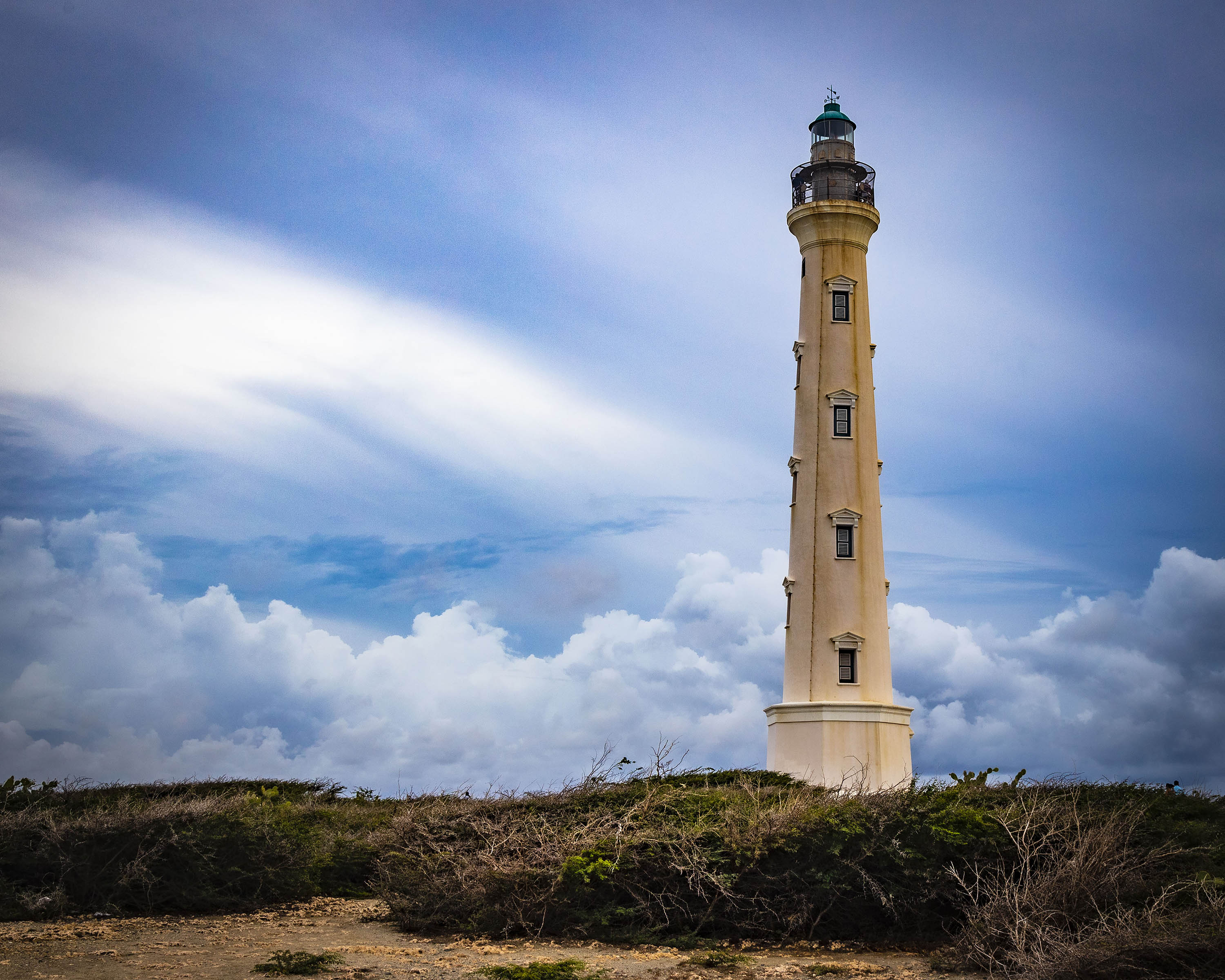California Lighthouse tower against dramatic Caribbean sky in Aruba - 16x20 metal print
