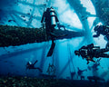 Divers working beneath offshore structure at Flower Garden Banks sanctuary - 16x20 metal print