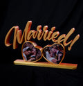 Married photomagnet frame with two heart-shaped slots for heart-shaped photomagnets
